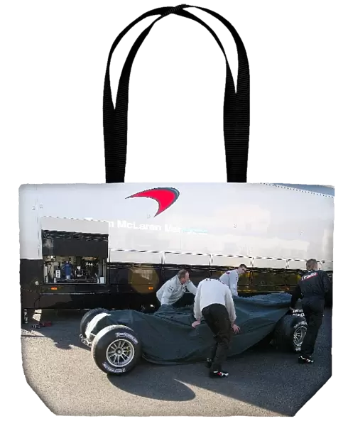 Formula One Testing: The new McLaren MP4  /  18 is unloaded from a truck prior to its debut test
