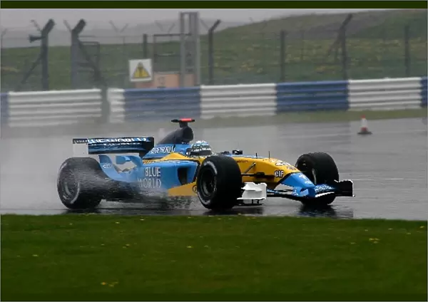 Formula One Testing: Allan McNish Renault RS23 at a wet Silverstone
