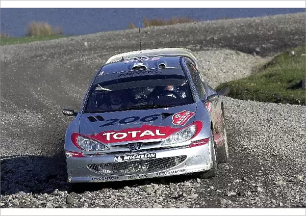 World Rally Championship: Juuso Pykalisto with co-driver Esko Mertsalmi Peugeot 206 WRC in action on Stage 4, Rheola