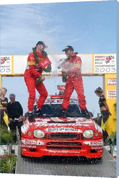 British Rally Championship: Jonny Milner and Nicky Beech celebrate with champagne