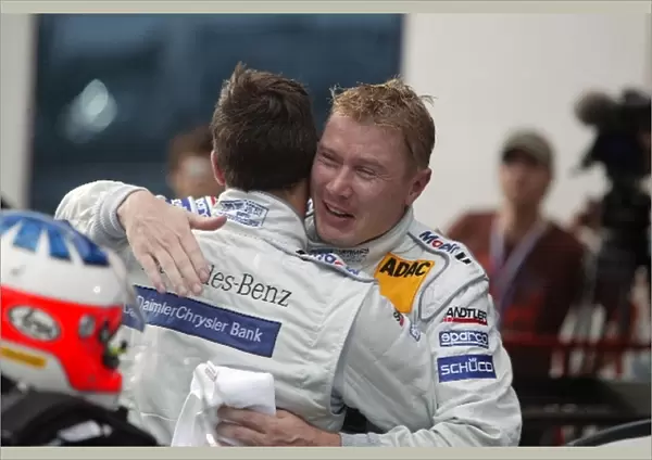 DTM: Mika Hakkinen congratulates AMG Mercedes team mate Gary Paffett who won the race