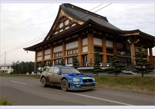 FIA World Rally Championship: Petter Solberg, Subaru Impreza WRC, passes a temple