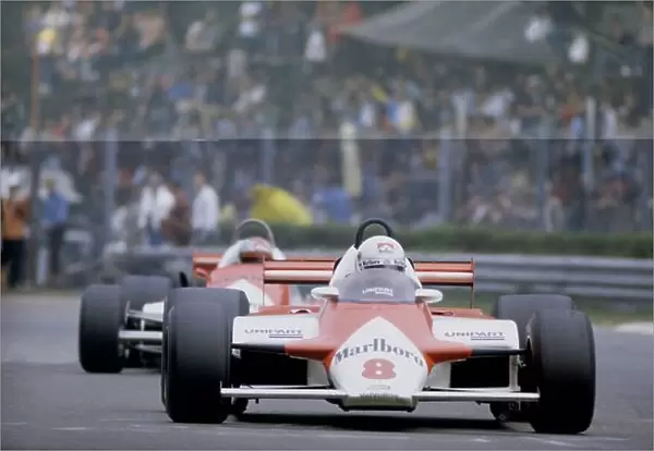 1981 Italian Grand Prix Monza, Italy. 11-13 September 1981. Andrea de Cesaris (McLaren MP4 / 1-Ford Cosworth), 7th position, leads Mario Andretti (Alfa Romeo 179C). Ref - 81ITA25. World Copyright - LAT Photographic