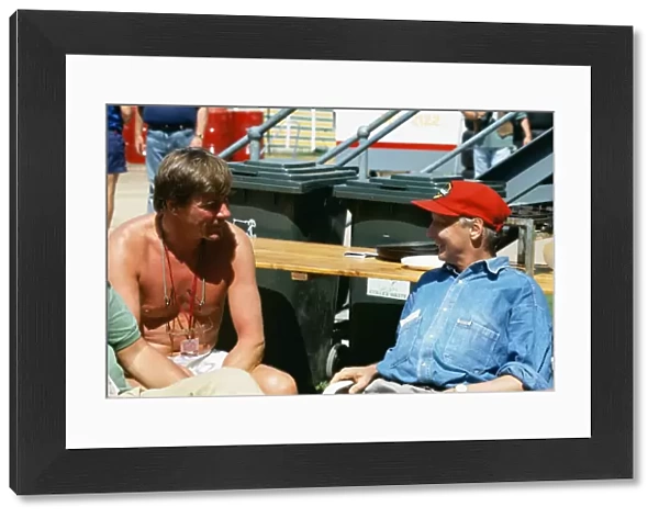 1992 Australian Grand Prix: Former World Champions, James Hunt and Niki Lauda chat in the paddock, portrait
