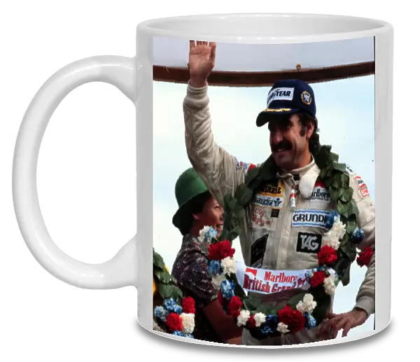 REGAZZONI WINS BRITISH GP 1979 FOR WILLIAMS: Clay Regazzoni, 1st position on the podium