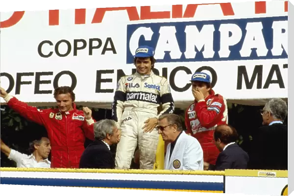 1983 Italian Grand Prix: Nelson Piquet 1st position, Rene Arnoux 2nd position and Eddie Cheever 3rd position on the podium
