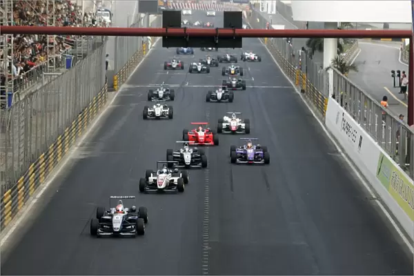 Formula Three. 16-19th November. Circuit de Guia: Kamui Kobayashi, leads the field away from the start. Action