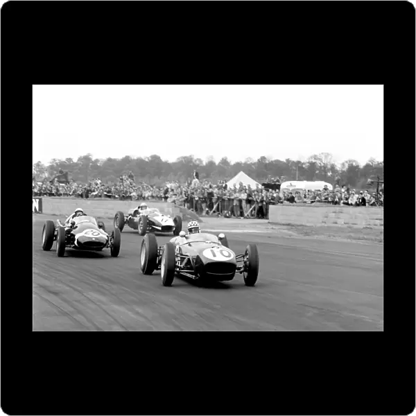 1960 International Trophy, Silverstone, England: Innes Irelands Lotus 18 leads Stirling Moss in a Cooper T51 and Keith Greene in a Cooper T45