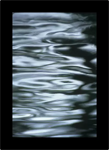 Silver Water Ripples And Light Reflections