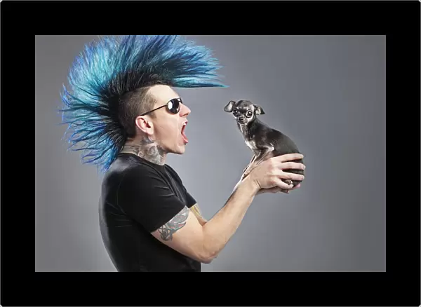 A Man With A Blue Mohawk Yells At His Dog
