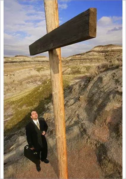 Businessman Looking Up At Cross