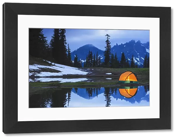 Camping tent at sunset by a small reflecting pond near tipsoo lake mount rainer national park near seattle; Washington united states of america