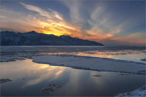 Sheets Of Ice Being Carried Out With Outgoing Tide On Turnagain Arm At Sunset, South Of Anchorage, Alaska