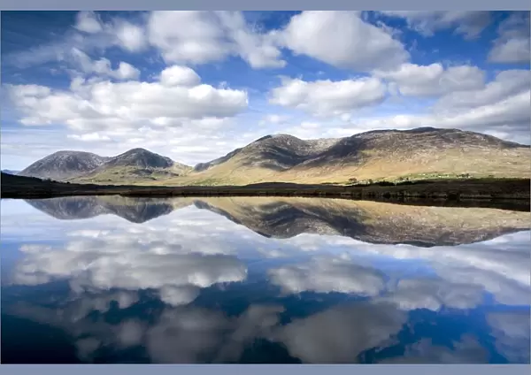 Maumturks, Co Galway, Ireland; Lake Surrounded By A Mountain Range