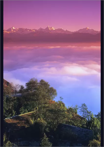 Nepal, Pink sunset and himalayan mountains in background; Nagarkot