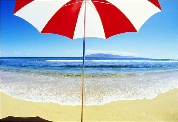 Red And White Umbrella On The Beach, Blue Sky And Ocean