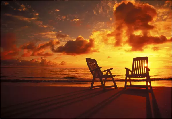 Beach Chairs Along Shoreline At Twilight, Amazing Sunset