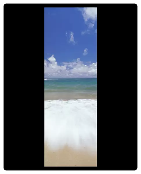 Ocean Shore Break Action Upon Shoreline, Turquoise Water And Blue Sky With Clouds Panoramic