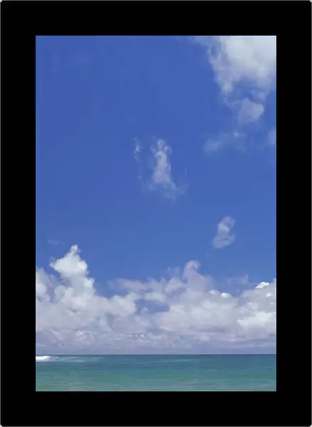 Ocean Shore Break Action Upon Shoreline, Turquoise Water And Blue Sky With Clouds Panoramic