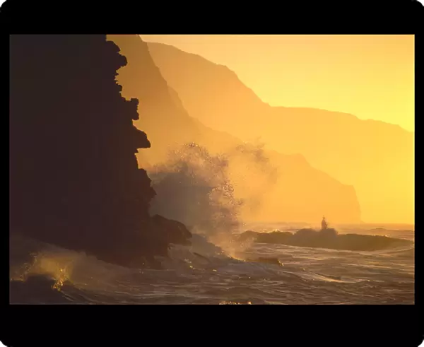 Hawaii, Kauai, Na Pali Coast At Sunset From Haena, Crashing Waves Against Rocks, Misty Yellow Sky
