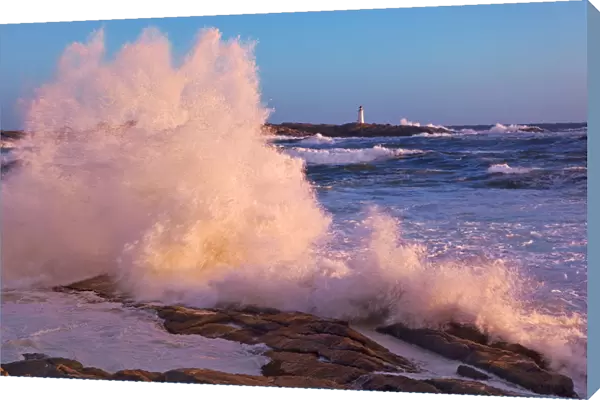Strong Winds Blow Waves Onto Rocks In Front Of Lighthouse At Peggys Cove, Nova Scotia