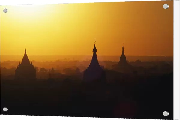 Myanmar (Burma), Mandalay, Sagaing Hills Pagodas Silhouetted At Sunrise