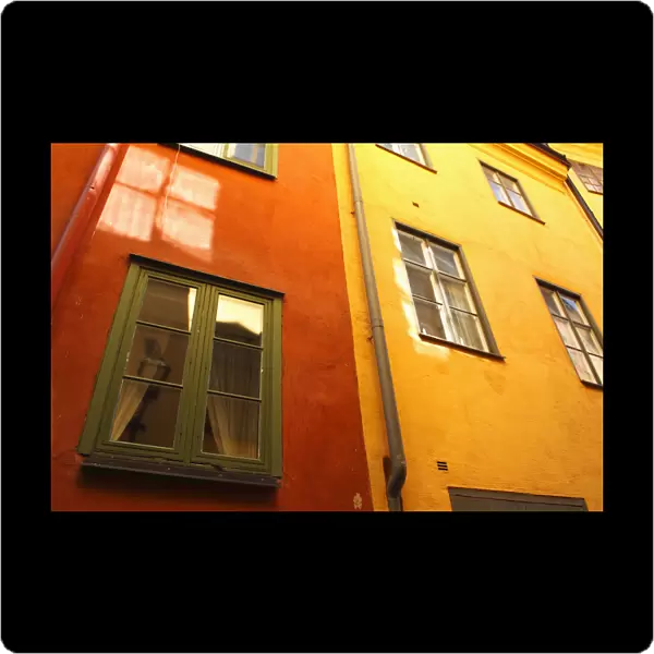 Low Angle View Of Red And Yellow Painted Buildings; Stockholm, Sweden