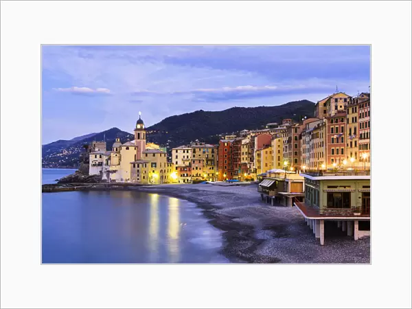 Buildings Illuminated By Lights Along The Waters Edge At Sunrise; Camogli, Liguria, Italy
