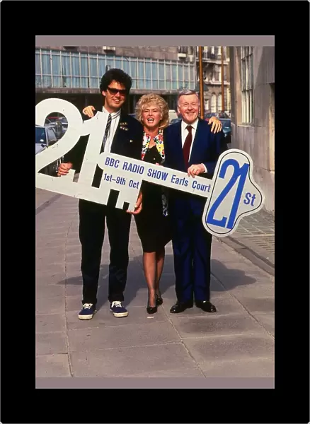 DJ Mike Read March 1989 with Jimmy Young and Gloria Hunniford holding 21st key