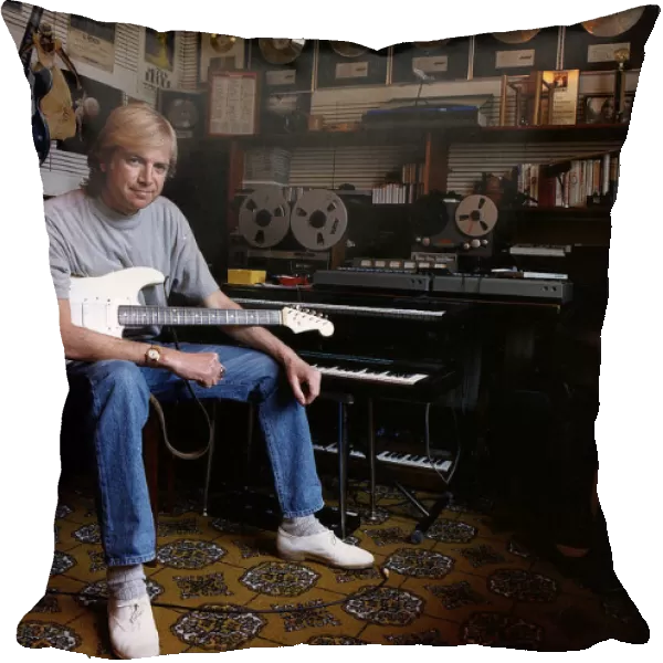 Justin Hayward lead singer of Moody Blues sits in his private recording studio at his