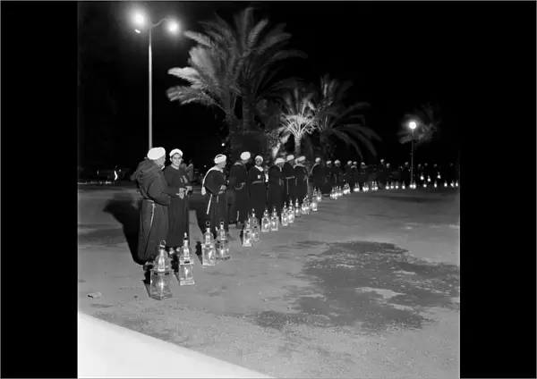 Soldiers on guard with their lamps in Marrakech, Morocco December 1952
