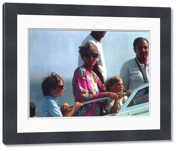 Princess Diana with their two young sons Prince Harry and Prince William on board an