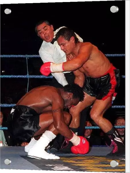Nigel Benn goes down after a blow to the head by Juan Carlos Gimenez at the NEC