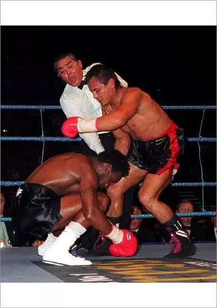 Nigel Benn goes down after a blow to the head by Juan Carlos Gimenez at the NEC
