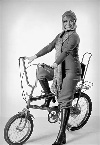 Ann Aston seen here in the studio modelling the new Chopper bike Circa 1975