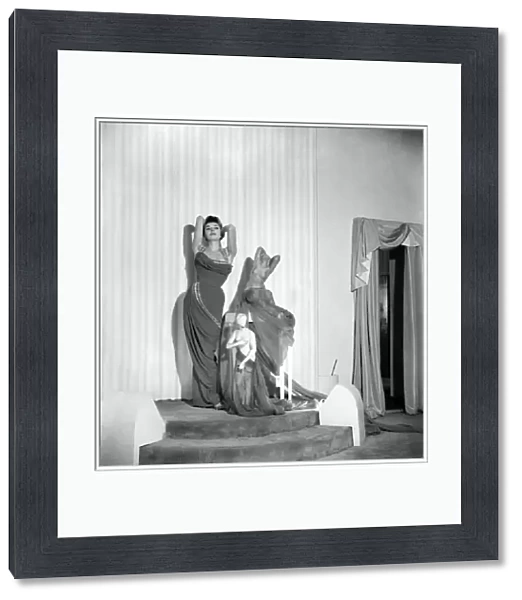 Model June Sweetzer poses wearing an elegant long dress. September 1952 C4772