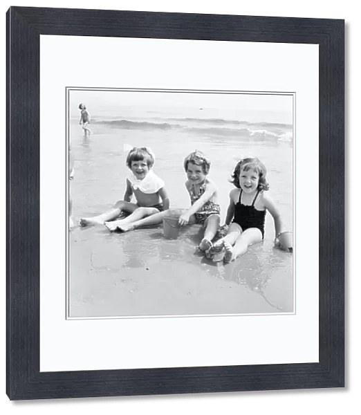 Children enjoying the water at Bournemouth Beach. June 1960 M4341-004