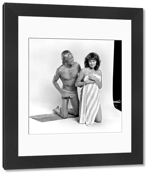 Models pose as a shy couple in the studio August 1977 77-04388-004
