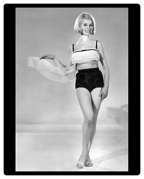 Model Vyvyan Dunbar wearing swimwear top and shorts. July 1965 P007738