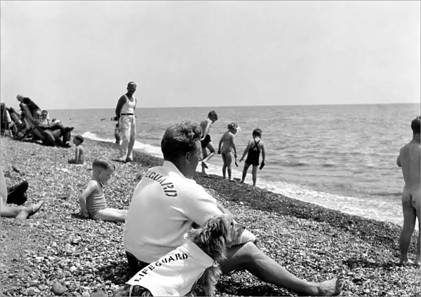 Lifeguard George Wheeler and his dog - Brighton Life - Saver. July 1952 C3455