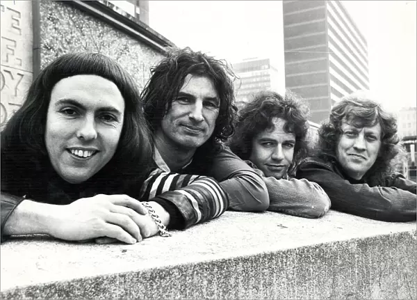 Glam rock group Slade posing for pictures in Birmingham City Centre