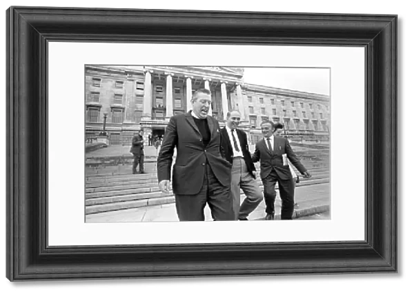 The Reverend Ian Paisley and Major Ronald Bunting leave the Stormont building in Belfast
