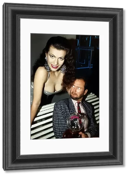 Kenny Everett comedian who died of aids with Cleo Rocos leaning over him dbase June