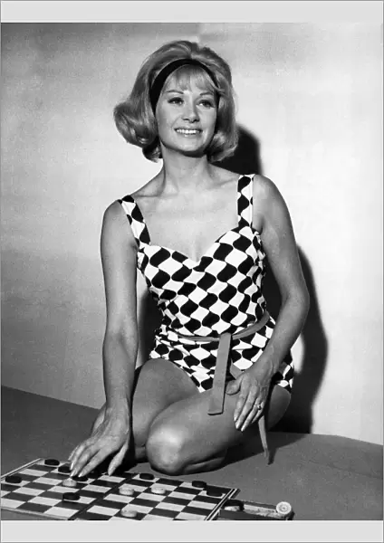 Helen Curtis wears a black and white harlequin swimsuit