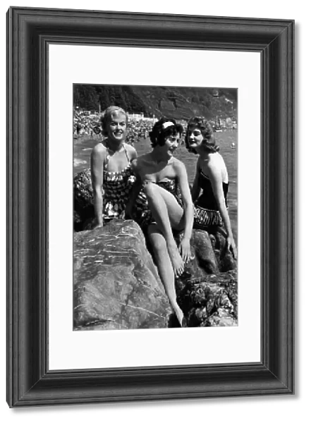 Holidays: Three bathing beauties seen here sunbathing on a Devon beach. July 1958 P013217