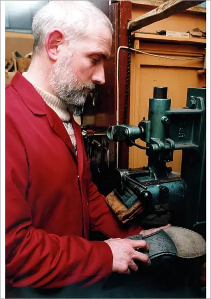 Edwin Macklow, second generation cobbler at work in his fathers shop
