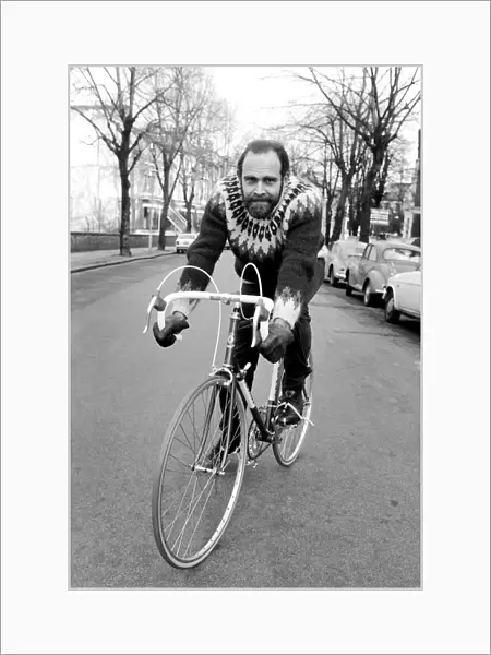 Cycling journalist and writer Mr. Richard Ballantine riding a bicycle February
