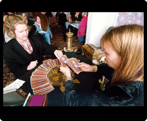 Someone getting their fortune told by tarot cards in 1994