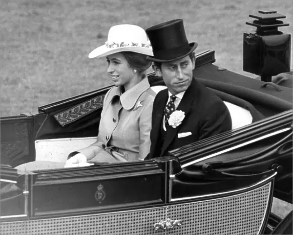 Prince Charles, Prince of Wales with his sister Princess Anne drive down the course at