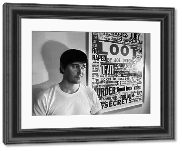 Playwright Joe Orton next to a promotional poster of his new play Loot